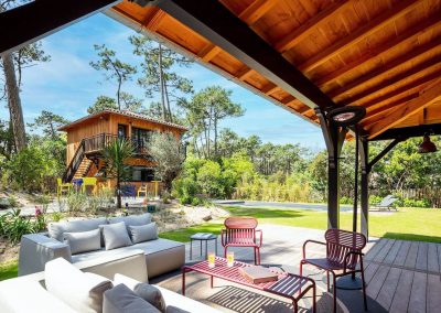 timber eco villa with outdoor seating area